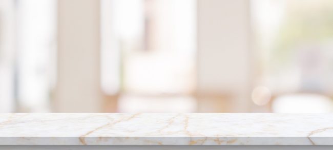 table top with blurred kitchen cafe restaurant interior background